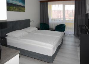 Postel nebo postele na pokoji v ubytování Apartmány - Frymburk My Family