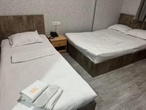Postel nebo postele na pokoji v ubytování Hotel Skib