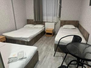 Postel nebo postele na pokoji v ubytování Hotel Skib