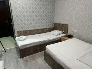 Postel nebo postele na pokoji v ubytování Hotel Skib