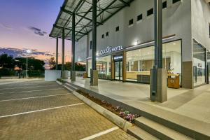 a store front of a building with a lot of windows at Oasis Hotel in Gaborone