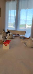 a table with a tea pot on top of it at Casa Alysa Agriturismo in Tavullia +15 photos