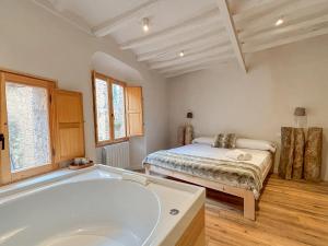 Posteľ alebo postele v izbe v ubytovaní Clauhomes Casa Rural Deluxe