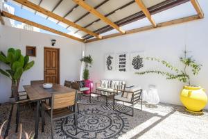 a dining room with a table and chairs at Villa Sakura in Lindos