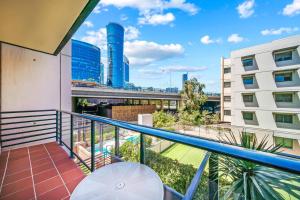 a balcony with a view of a building at Perth city BNB l CBD and Pool view - 1xKing bed and 2xSingle beds in Perth