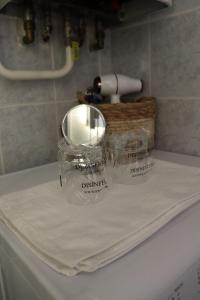 a towel sitting on top of a bathroom sink at Studio apartman Zubak in Đakovo +33 photos