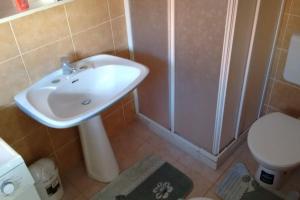 a bathroom with a sink and a shower and a toilet at Cà du Brenta Casa nel cuore della Liguria in Chiusavecchia +29 photos