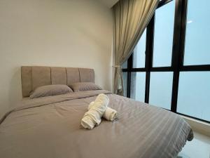 Postel nebo postele na pokoji v ubytování D'Pristine Medini Johor Bahru