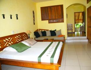 Ένα ή περισσότερα κρεβάτια σε δωμάτιο στο Vanila Hotel & Spa