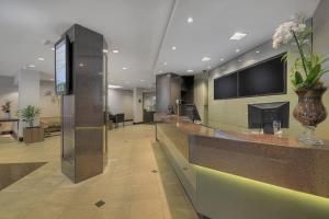 TV a/nebo společenská místnost v ubytování Hotel Deville Curitiba