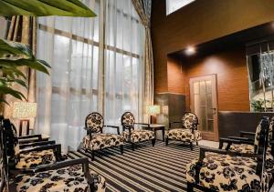 a room with chairs and a table and windows at APA Hotel TKP Sapporo Eki-Kitaguchi Excellent in Sapporo