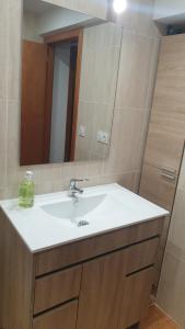 a bathroom with a sink and a mirror at Cabirol in Camprodon