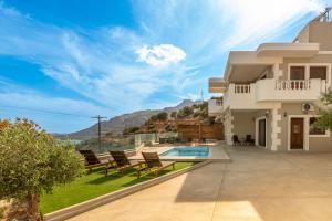 a villa with a view of the mountains at Evelyn Villa Crete in Tsoutsouros