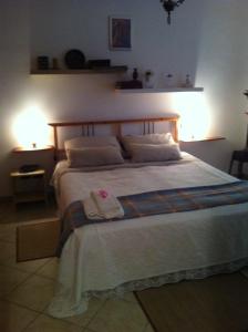 Giường trong phòng chung tại B&B Il Portico del Conte