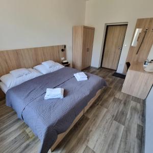 Postel nebo postele na pokoji v ubytování Penzion Brothers U Koňa