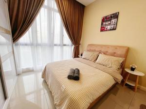 Postel nebo postele na pokoji v ubytování D'Pristine Medini Johor Bahru