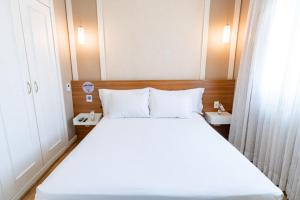Cama ou camas em um quarto em Intercity The Universe Paulista