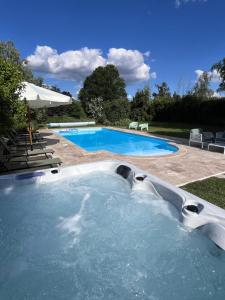 a swimming pool in a yard with at Le Clos Gabrielle in Châtellerault