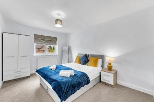 Ένα ή περισσότερα κρεβάτια σε δωμάτιο στο Brook Meadow House, 4 bed house, Manchester