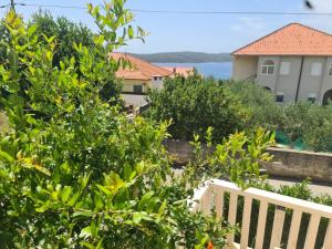 a view from the balcony of a house with trees at Apartments Mia in Okrug Gornji