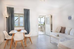 a living room with a couch and a table at Lagadia Village in Antiparos