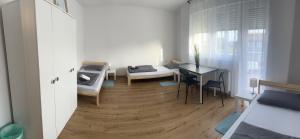 Ένα ή περισσότερα κρεβάτια σε δωμάτιο στο Apartmani EMA Novska