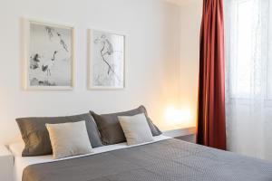a bedroom with a bed and a window at Lagadia Village in Antiparos