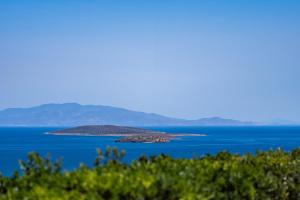 an island in the middle of a large body of water at Lagadia Village in Antiparos