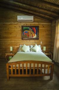 Postel nebo postele na pokoji v ubytování Las Cabañas Encantadas de Nindirí