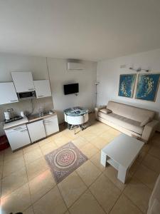 a living room with a couch and a table at PortaLecce B&B in Brindisi