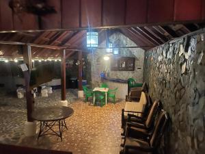 a room with chairs and a table and a table and chairs at villa mariposa in Santo Domingo