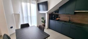 Kuchyň nebo kuchyňský kout v ubytování Apartman MILA TAR + 10 fotografií