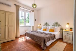 Postel nebo postele na pokoji v ubytování Villa Elighe