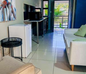 a living room with a couch and a table at View Inn Exclusive Lodge in Nelspruit