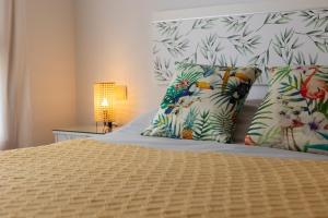 a bedroom with a bed with two pillows and a bed sidx sidx at Piso A Pie de Playa - A Corna in San Pedro