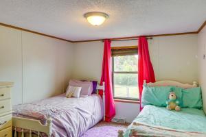 a bedroom with two beds and a window at Kadoka Home about 22 Mi to Badlands National Park! in Kadoka