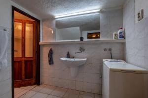 a bathroom with a sink and a mirror at Chatka v lese in Ružomberok +52 photos
