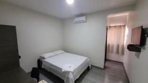 Postel nebo postele na pokoji v ubytování Hotel Valentine