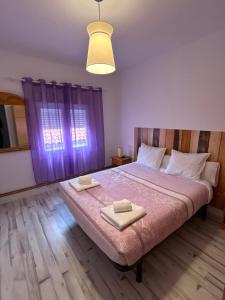 A bed or beds in a room at Apartamentos El Conde