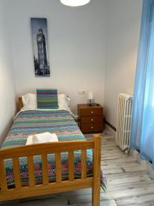 A bed or beds in a room at Apartamentos El Conde