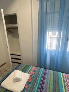 A bed or beds in a room at Apartamentos El Conde