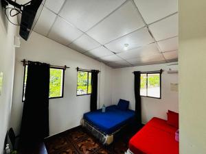 a room with two beds in a room at LA CASONA SV Hostal in La Libertad +82 photos
