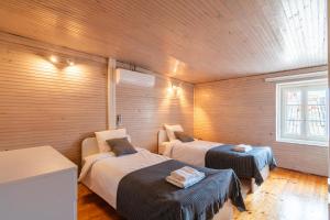 a room with two beds and a couch and a window at Casa di Pag by Pag tours in Pag +21 photos