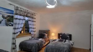 Rúm í herbergi á 3- Zimmer-Wohnung in Linz Leonding