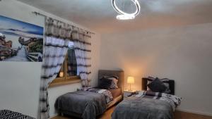 Rúm í herbergi á 3- Zimmer-Wohnung in Linz Leonding