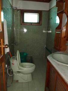 a bathroom with a toilet and a sink at Available for Kalam in Kalām