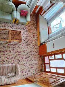 an interior of an rv with shelves and a window at Available for Kalam in Kalām +28 photos