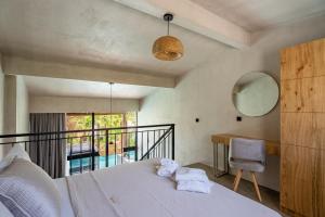 Katil atau katil-katil dalam bilik di Kallithea Village hotel