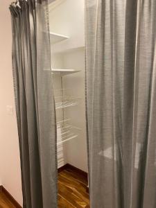 a room with a curtain and some shelves at Casa Maria in Grottaglie