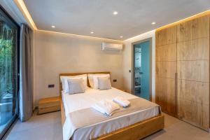 Katil atau katil-katil dalam bilik di Kallithea Village hotel